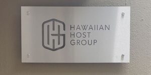 Hawaiian Host Group silver signage with standoffs