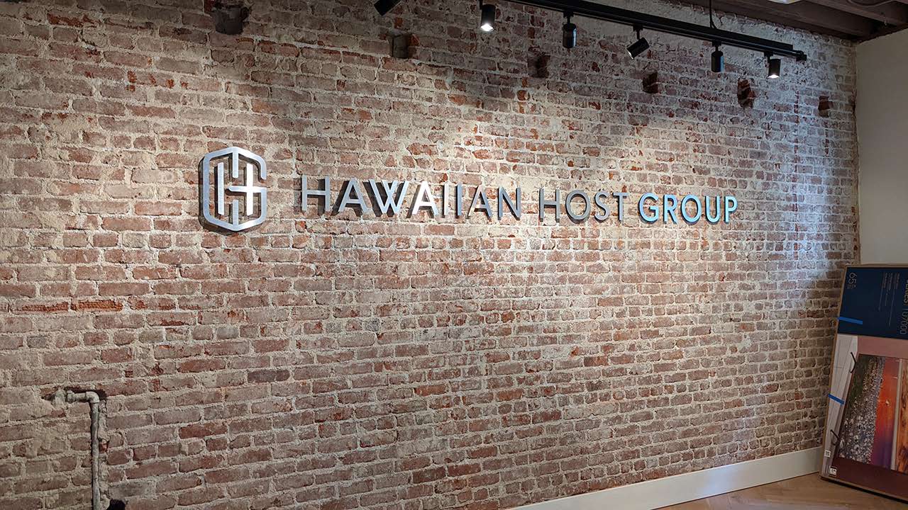 Hawaiian Host Group silvering lettering sign on brick wall